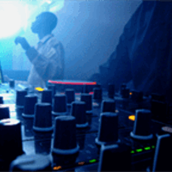 Mixing deck DJ in club