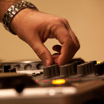 Hand on mixing desk